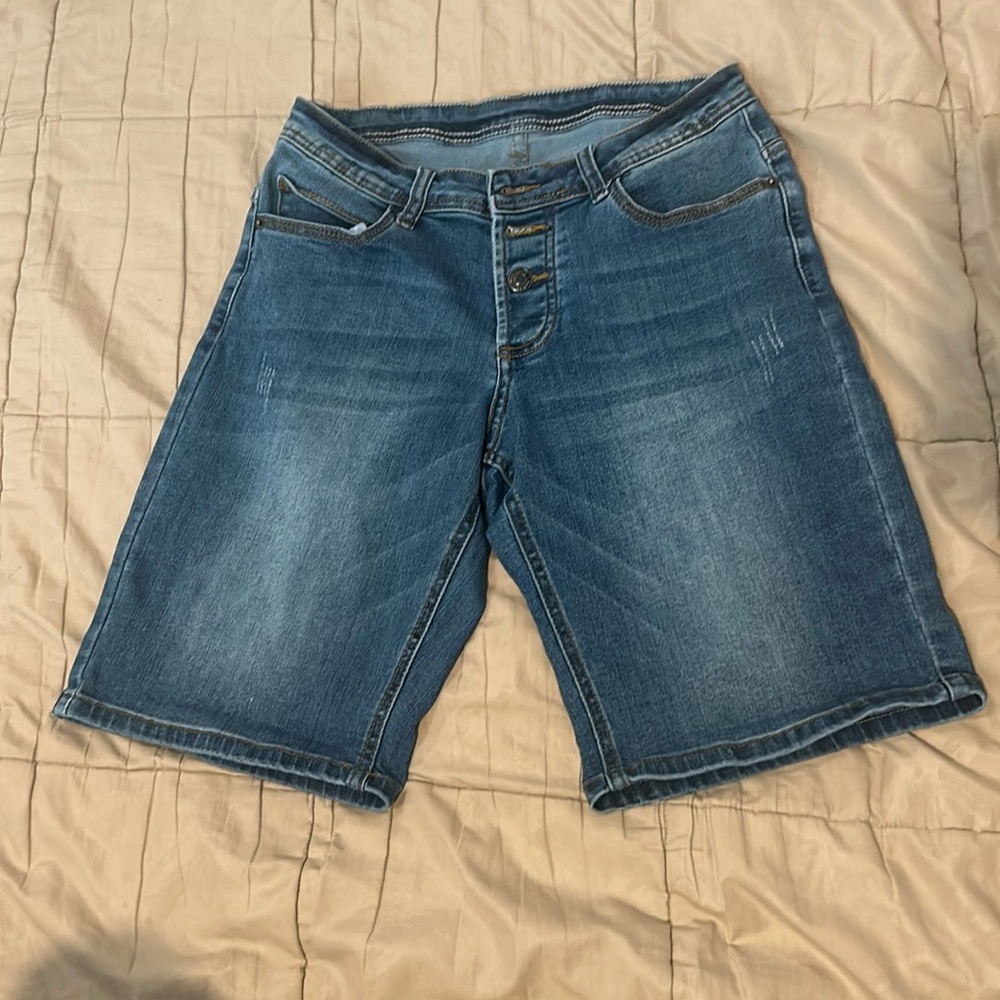 Dark washed long denim shorts. Size 4, barely worn.